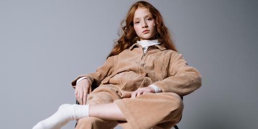 Girl sitting with no shoes